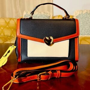 “Elite Bag with Heart Design and Classic Tones.”